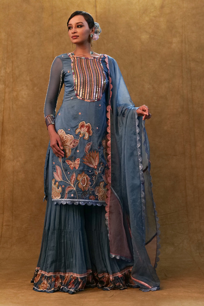 Blue Applique Work Kurta Set Paired With Flared Sharara And A Dupatta.