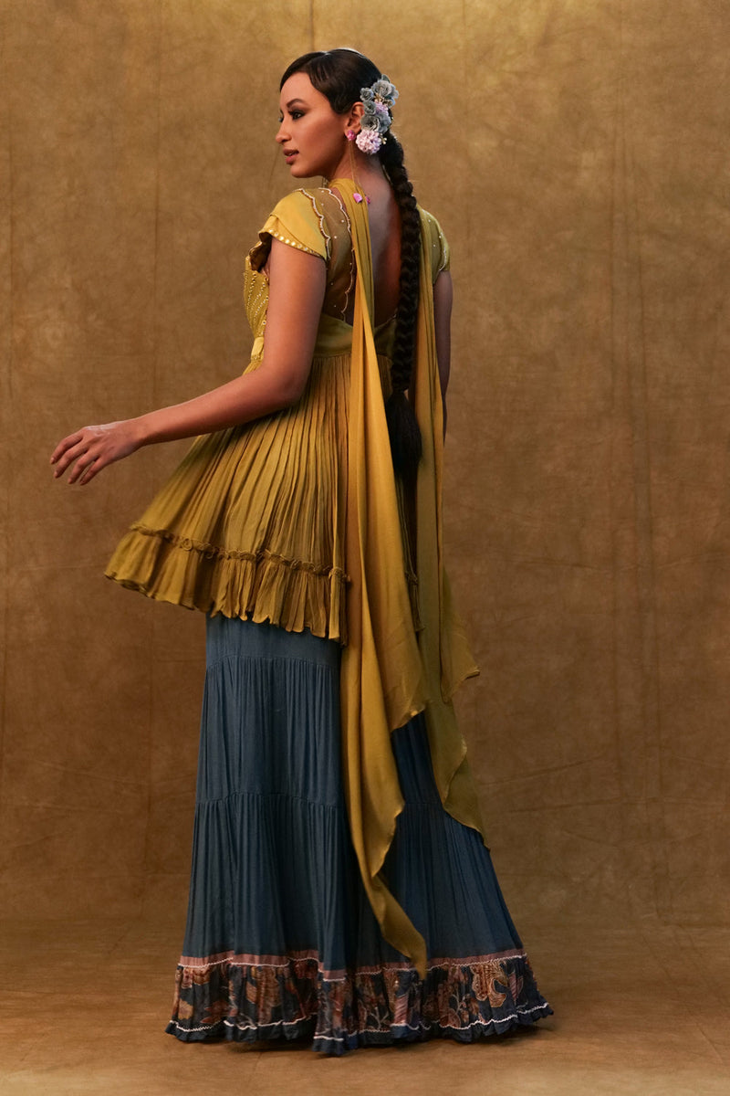 Sharara Set Paired With Flared Top And A Neck Dupatta.